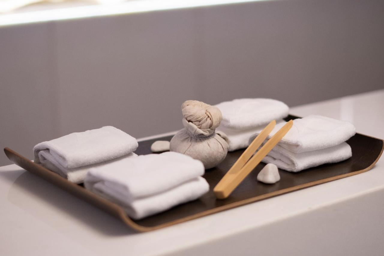 Epic Sana Lisboa Hotel Exterior foto A set of folded towels